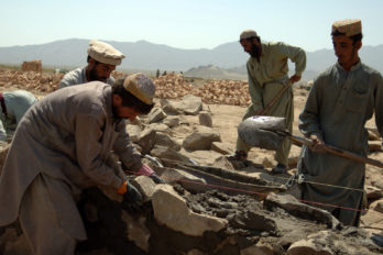 Afghan contractors work on building a wall that will surround the Afghani Border Police (ABP) compound in Dochina, Afghanistan, Sept. 2, 2005.  The construction is contracted by the U.S. Army for ABP and will result in brand new border police checkpoints.  (U.S Army photo by Pfc. Michael Zuk)  (Released)