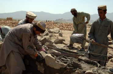 Afghan contractors work on building a wall that will surround the Afghani Border Police (ABP) compound in Dochina, Afghanistan, Sept. 2, 2005.  The construction is contracted by the U.S. Army for ABP and will result in brand new border police checkpoints.  (U.S Army photo by Pfc. Michael Zuk)  (Released)