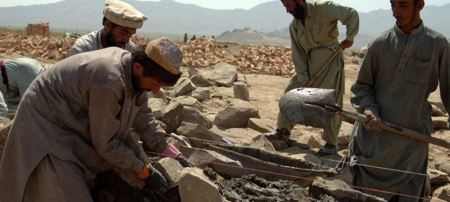 Afghan contractors work on building a wall that will surround the Afghani Border Police (ABP) compound in Dochina, Afghanistan, Sept. 2, 2005.  The construction is contracted by the U.S. Army for ABP and will result in brand new border police checkpoints.  (U.S Army photo by Pfc. Michael Zuk)  (Released)